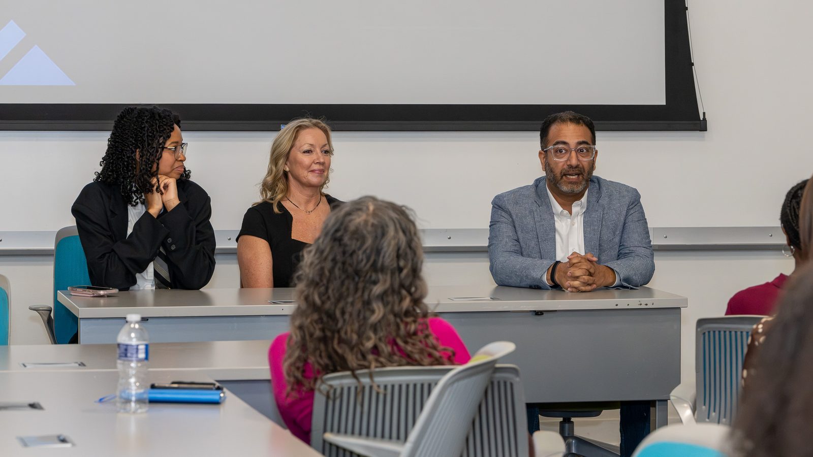 Aneil Razvi answering a student question on the AIGA Dallas Mini-Con 2026 industry panel at UT Dallas